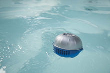 Load image into Gallery viewer, Frog @ease Floating SmartChlor Cartridge in a hot tub