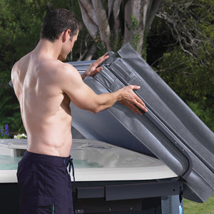 A man using a Lift N Glide Hot Tub Cover Lifter